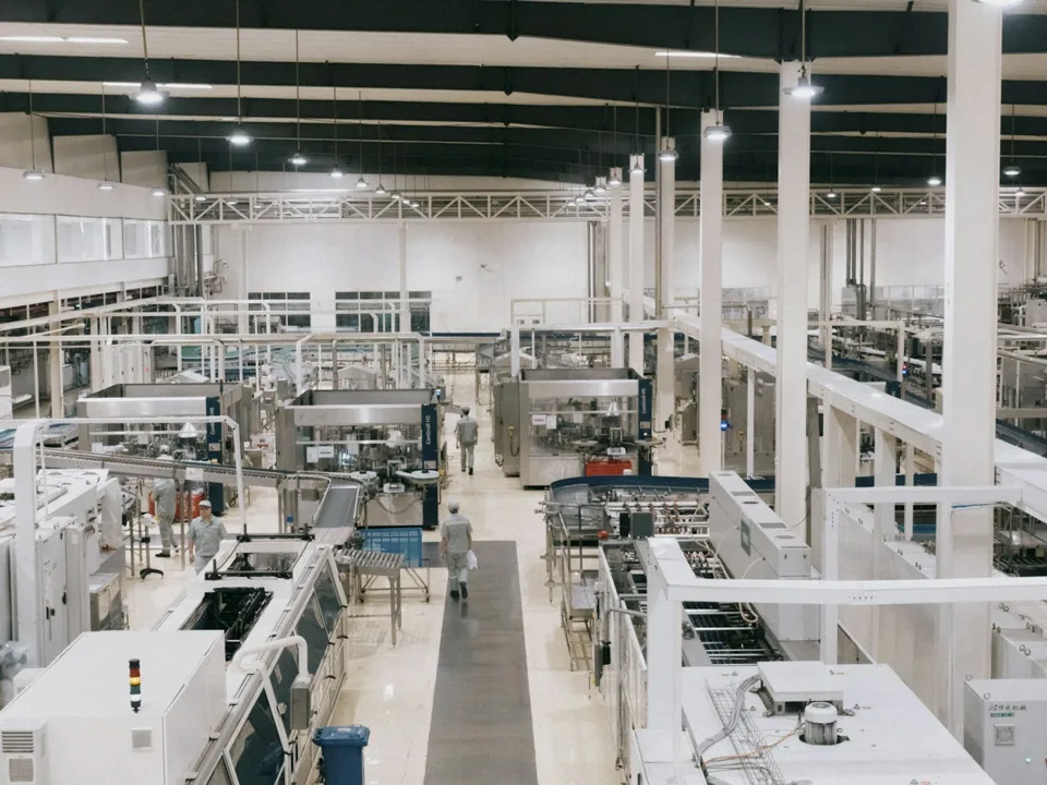Machinery and production lines inside a manufacturing facility.